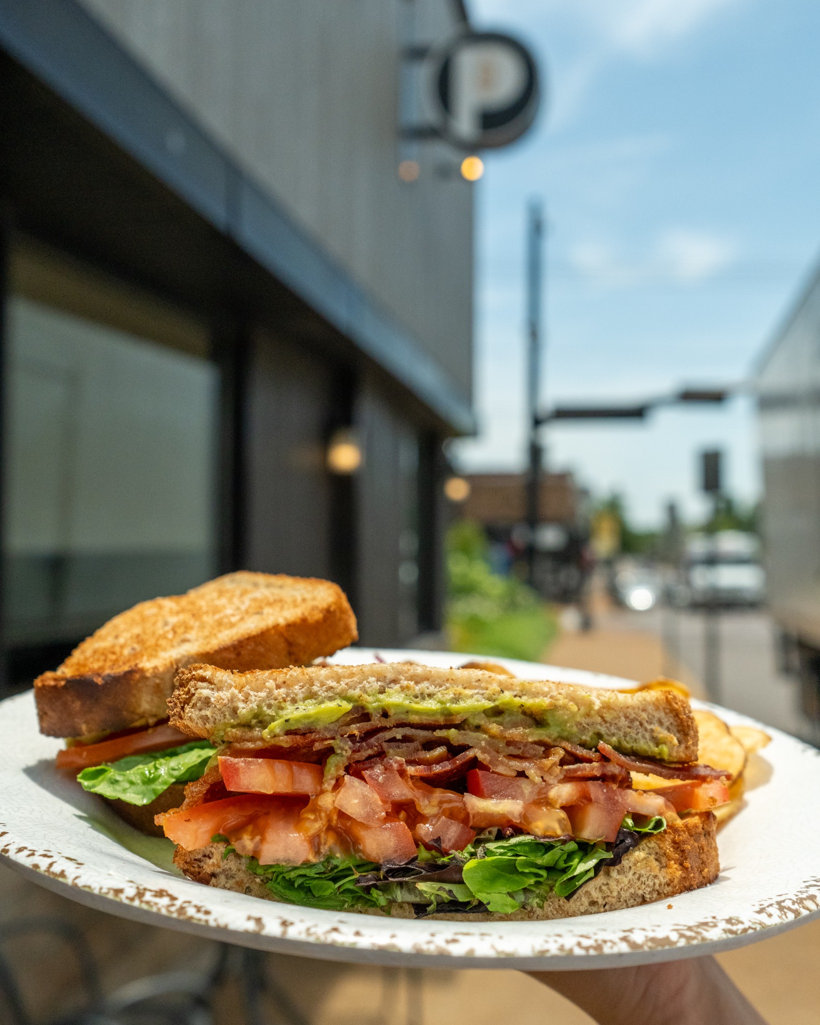 BLTA sandwich outside The Pioneer Bakery Cafe